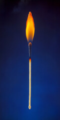 Burning Matchstick on Blue Background   Flame  Fire  Wood  Match  Safety  Ignition  Light