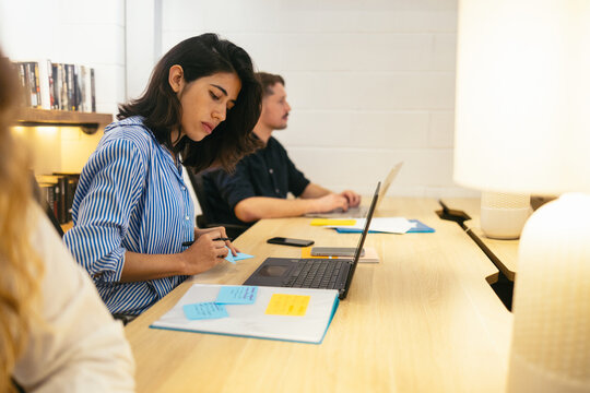 Workers doing overtime in the office