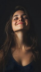 A woman with a smile on her face and black background