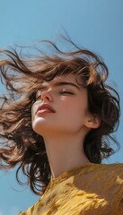 Fototapeta premium A woman with a windy hair blowing in the air