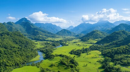 A breathtaking landscape unfolds with rolling green hills and towering mountains under a clear blue sky. A meandering river adds charm to the vibrant rural scenery