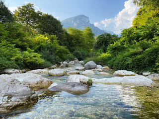 Shallow, crystal clear stream (Rio Cavallo) in the Italian mountains.