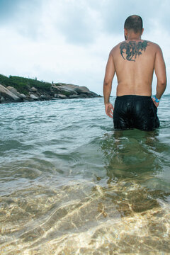 Man standing in  ocean water