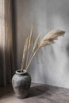 Clay pot with dried grass decor