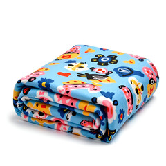 Cozy blue fleece blanket with whimsical animal patterns ideal for home decor and warmth, photography of still life concept.