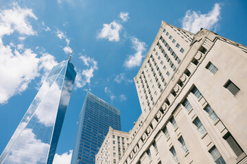 Skyscrapers rising above Manhattan against a clear blue sky