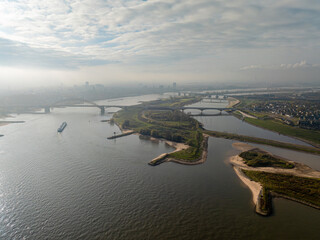 Aerial view of the room for the river project at the Dutch city of Nijmegen, with constructed additional waterway to provide more space for the Waal river during high water, future proof design