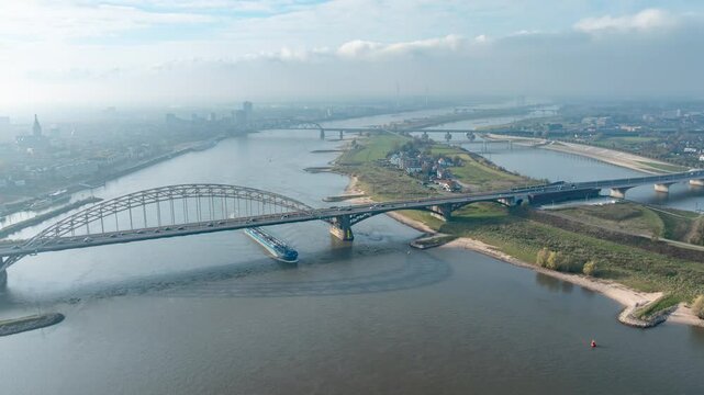 Aerial time lapse of the room for the river project at the Dutch city of Nijmegen, with constructed additional waterway to provide more space for the Waal river during high water, future proof design