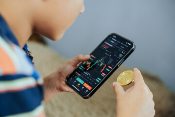 Young Analyst with Bitcoin and Trading Charts, Exploring Economy