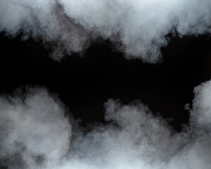 White smoke rises and swirls against a dark background, forming soft, cloudy patterns. The scene is moody and atmospheric, perfect for use as footage or for creating dramatic visual effects