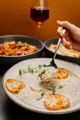 Creamy mushroom soup with herbs, parmesan, and crispy croutons, comforting gourmet dining experience