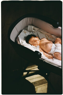 the newborn lies in the sun and gets vitamin D.