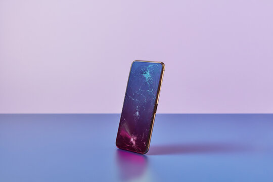 Destroyed gadget with deep fractures on display glass