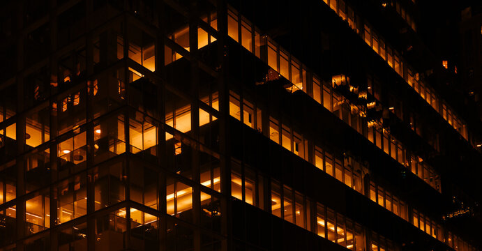 Illuminated city building exterior at night in NYC