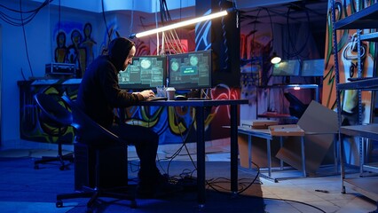 Naklejka premium Hacker in hidden base successfully getting past anti tamper measures implemented by companies to protect products. Cracker pirating software and video game releases, camera A handheld camera shot