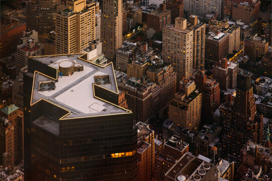 Aerial view of NYC buildings at sunset showcasing urban density