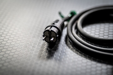 Electric Cable Plugged in with Texture Background - Power and Connectivity Symbol