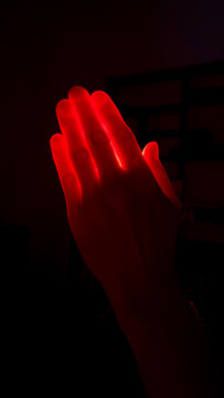 Red Glow Hand in Dark Ambience