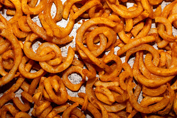 Curly Fries on a metal tray 