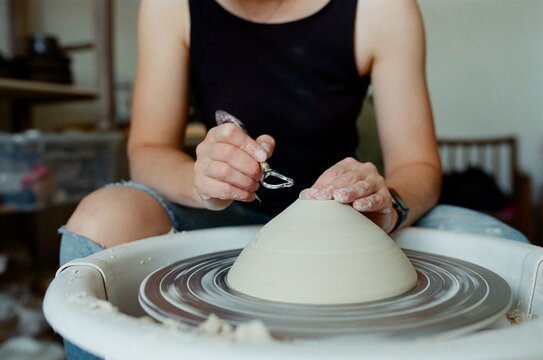 Creating a Clay Bowl on a Spinning Pottery Wheel