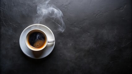 A steaming cup of coffee on a dark background, perfect for a morning pick-me-up or a cozy evening treat.
