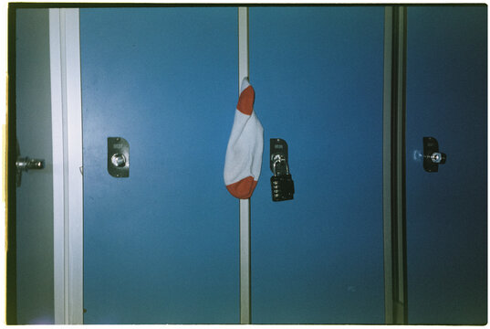 sock sticking out from a closed locker, 35mm film