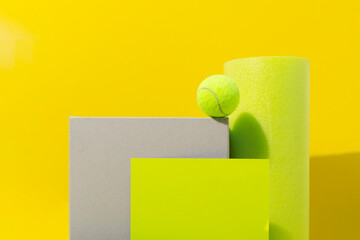 Bright neon yellow still life image of geometric objects of materials