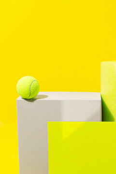 Bright neon yellow still life image of geometric objects of materials
