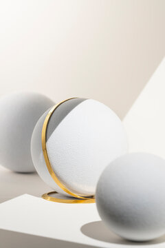 Gold chain with white spherical objects on white background