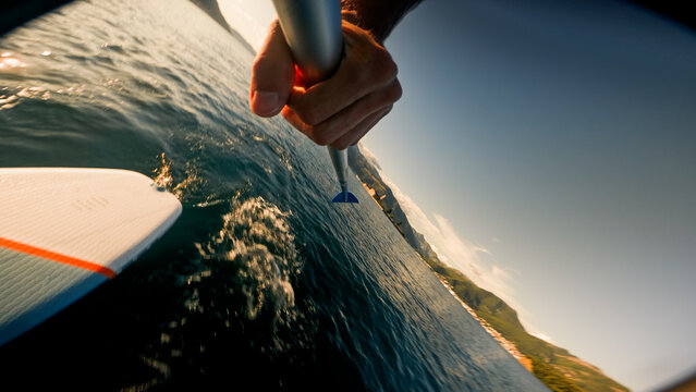Recreation on the SUP board at sunset