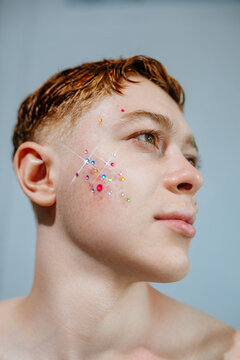 Beauty portrait with acne, pimples and rhinestones