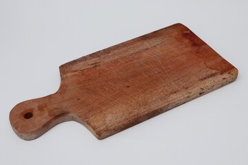 Wooden cutting boards are commonly used for cutting groceries and food displays
