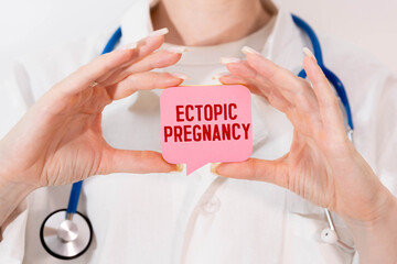 Ectopic Pregnancy. The word is written on a slip of colored paper.