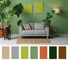 Monstera houseplants, glowing lamp and grey sofa near green wall. Different color patterns