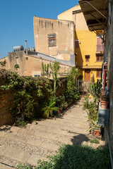 Colorful Narrow street with stairs of the old town of Agrigento, Sicily, Italy