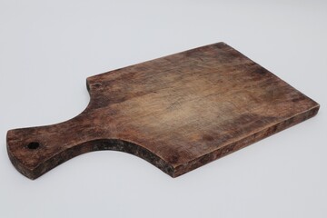 Wooden cutting boards are commonly used for cutting groceries and food displays