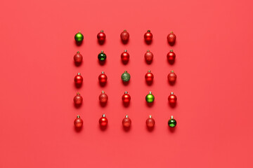 Composition with different Christmas balls on red background