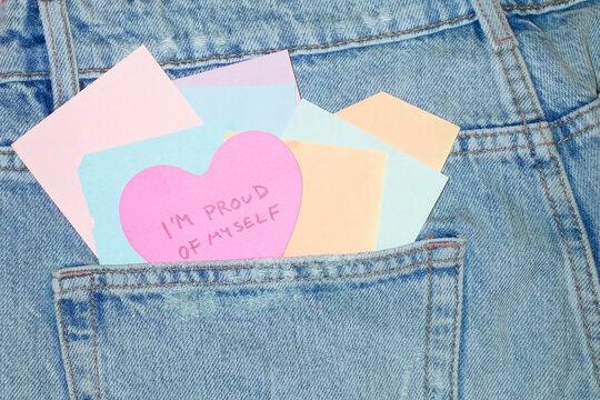 Jeans & heart post-it note saying "proud of myself" about self-love