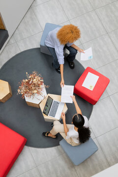 Top view of two coworkers in a business meeting