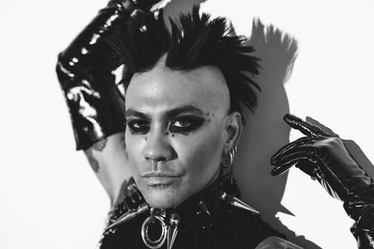 Edgy punk portrait featuring bold makeup and accessories