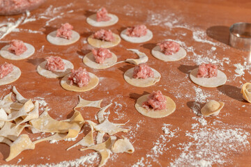 Kitchen table with preparations for meat dumpling