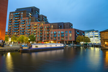 Leeds wharf canal with Aire river at blue hour. England