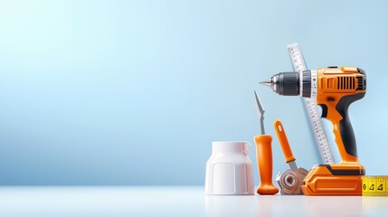 Set of professional handyman tools including a drill, measuring tape, level, and utility knife displayed on a clean surface.