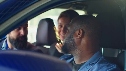 Happy customers shaking hands with car showroom salesman after finishing test drive and being satisfied. Clients reaching agreement with agent in dealership after driving vehicle, camera A