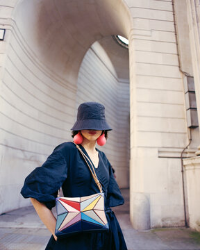 Fashionable Woman With Colorful Bag in Urban Setting