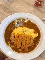 Japanese pork cutlet with egg omelette curry rice. Japanese food. Pork tonkatsu