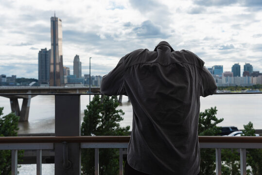 A man head down in the city