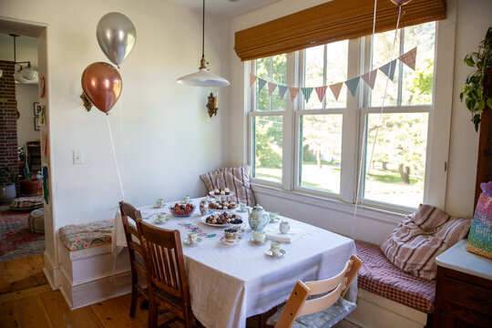 Fancy tea party birthday party for child set up in the kitchen at home