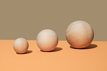 wooden balls of different sizes side by side
