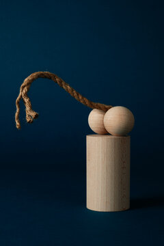wooden balls and curved string
